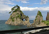 A rock formation by the sea coast.