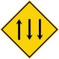 Three-lane carriageway ahead, with two lanes in the opposing direction.