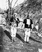 Two Upper Reka men: A man from Reč on the left and a man from Strezmir on the right.