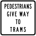 pedestrians give way to trams