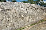 A large rock with abstract rock carvings