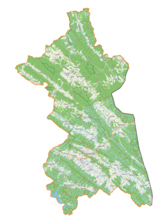 Mapa konturowa gminy Ustrzyki Dolne, na dole nieco na prawo znajduje się punkt z opisem „Hoszów”