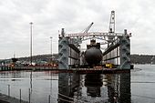 A bow-on view looking down on Miami in the auxiliary medium repair dock Shippingport (ARDM-4) during a routine hull inspection at Naval Submarine Base New London. (16 March 1994)