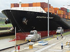 Locomotives Tow Container Ship through Miraflores Locks - Panama Canal.jpg