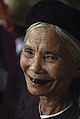 A Kinh Vietnamese woman with blackened teeth due to chewing betel nut, a common practice in Vietnam