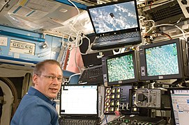 Frank De Winne monitors the HTV as it approaches the International Space Station