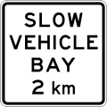(A42-4/IG-9) Slow Vehicle Bay Ahead (in 2 kilometres)