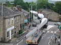 Image 29A turbine blade convoy passing through Edenfield in the U.K. (2008). Even longer 2-piece blades are now manufactured, and then assembled on-site to reduce difficulties in transportation. (from Wind power)