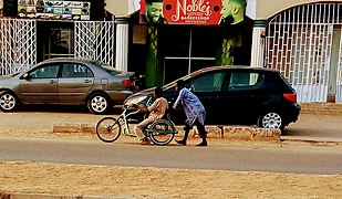 Handicapped boy on his bicycle.jpg