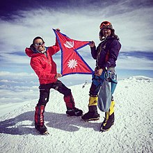 Temba Tsheri Sherpa (R) and Chhiring Dorje Sherpa holding the flag of -Nepal on the top of Mt.Denali (McKinley), 6168m above sea level. On 26 June 2015.jpg