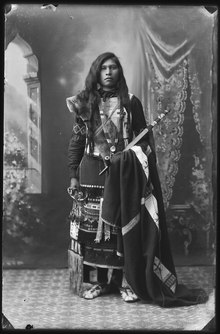 Black-and-white photographic portrait of Jimmie Sequint, a Northern Shoshone man in traditional dress.