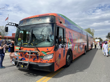 TransLink R6 rapid bus at a Vaisakhi parade in Surrey BC. The wrap design was inspired by Rumala Sahibs.