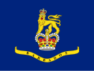 A blue flag with a crown and lion in the center, placed above a banner.