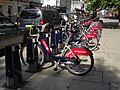Image 35"Boris Bikes" from the Santander Cycles hire scheme waiting for use at a docking station in Victoria.