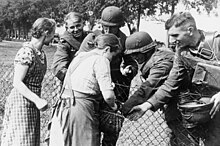 Photo of members of the German minority in Poland welcoming a small group of German soldiers.