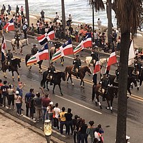 Dominican Army marching on Dominican Independence Day with flags