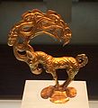 Gold stag with eagle's head and ten more heads in the antlers. Object inspired by Siberian Altai art. Nalinggaotu site, Shenmu County, near Xi'an.