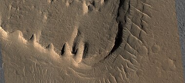 Close view of layered mesa with pyramid shapes, as seen by HiRISE under HiWish program