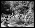Sightseers in the Wainui River and another small waterfall visible from the Wainui Falls Track (not Wainui Falls).[12] Late 1800s or early 1900s. From the Tyree Collection.