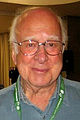 بيتر هيغز (1929 إلى الوقت الحاضر): حاصل على جائزة نوبل في الفيزياء في عام 2013، له العديد من الإسهامات في التناظر المنكسر في التآثر الكهروضعيف، بوزون هيغز، آلية هيغز.