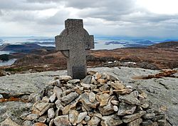 A cross marking the crash site near Holta. The plaque reads "In memory of those who died here 9 August 1961. 34 English school boys, their two teachers and the three crew members. Erected by friends in Rogaland".