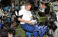 Thomas Reiter looks over a procedures checklist in the Zvezda Service Module