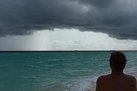 Man on sand bank in the Maldives looking at sea.jpg
