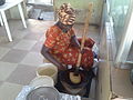 A woman pounding fufu to soften its texture. See also: → Category:Wiki Loves Africa 2014 (over 1400 photos).