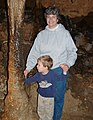 Visitors examining the only "touchable" cave formation at Florida Caverns State Park, 2004.