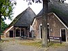 Boerderij Voorm. boerderij met achterbaander onder rieten wolfsdak (Voorm. Openbare Bibliotheek)