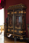 Baroque cupboard; by André Charles Boulle; c.1700; ebony and amaranth veneering, polychrome woods, brass, tin, shell, and horn marquetry on an oak frame, gilt-bronze; 255.5 x 157.5 cm; Louvre[57]
