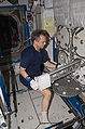 Robert Thirsk removes a dewar tray from the Minus Eighty Laboratory Freezer