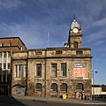 Sheffield Old Town Hall seen from the south from Castle Street in October 2016. A large banner advertises the building for sale.