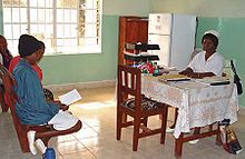 Nurse at Koidu Hospital Sierra Leone consulting with patients