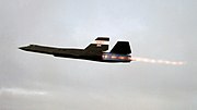 NASA’s SR-71 streaks into the twilight with full afterburner on the first night/science flight from the Dryden Flight Research Facility.