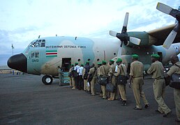 Ugandan civil police board BDF Air Wing C-130 in Kigali 2006-09-26.jpg