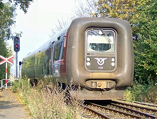 One of Vestsjællands Lokalbaner's IC2 trains entering Fårevejle station. Autumn 2003, IC2 1123.