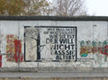 Graffiti next to paradox by Erich Fried