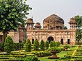 A view of the tomb with the garden in foreground