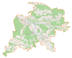 Mapa konturowa powiatu niżańskiego, na dole nieco na lewo znajduje się punkt z opisem „Muzeum Chrystusa Frasobliwego w Jeżowem”