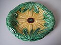 Bread plate or corn platter, temperature compatible coloured glazes on biscuit, naturalistic in style, surfaces molded in relief