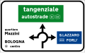 Directions at a roundabout in urban areas. The green panel indicates a motorway