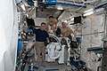 Jeffrey Williams, Soichi Noguchi (center) and T.J. Creamer pose with the Japanese Experiment Module Remote Manipulator System (JEMRMS) Small Fine Arm (SFA) .