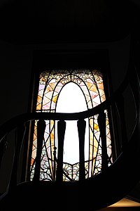 Stained glass window in stairway by Jacques Gruber
