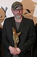 Wojciech Smarzowski holds of his "Orzel", Polish movie award, backstage at the 14rd Polsh Academy Awards, in Warsaw. Smarzowski won Audience Award for his film "Róża".