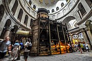 The Aedicule with the Coptic chapel to the left with golden roof; main entrance to the right