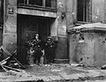 Insurgents from Ruczaj Battalion after fight for Mała PASTa building take pictures at the main entrance at Piusa 19 Street next to a bunker. 24 August 1944