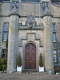 The main entrance to the mansion is a Tudor style porch