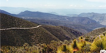 Gravel road through the arid interior slopes of the Sierra Madre Oriental, Municipality of Miquihuana, Tamaulipas, Mexico (10 August 2003)