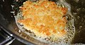 Potato latke made from Manischewitz brand mix frying in hot olive oil